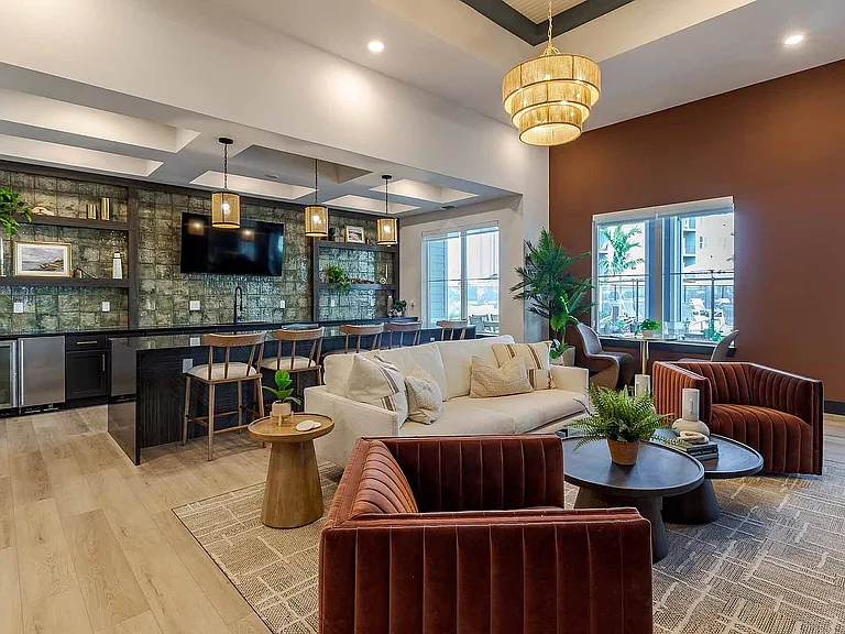 Unwind in the resident clubhouse lounge, where plush seating and a built-in bar make it easy to relax or socialize close to home.