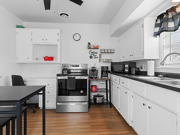 We have a coffee pot and Keurig at the house for our guests to use. There are also some starter k-cups to use for your arrival! And we a have some teas and sugar/sweeteners on our coffee station as well. They kitchen has a built in desk and a chair.