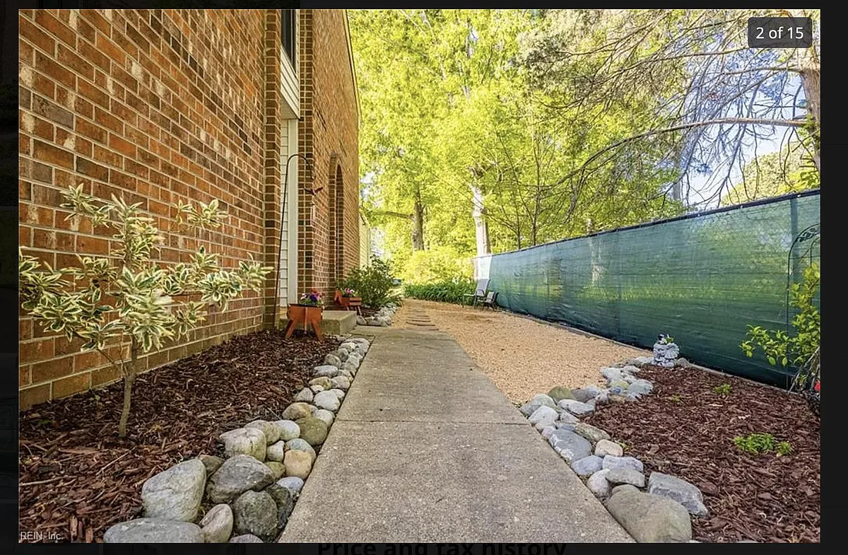 Private walkway to access the main entrance to the home. Surrounded by woods offering privacy. - 5037 Clairmont Ct