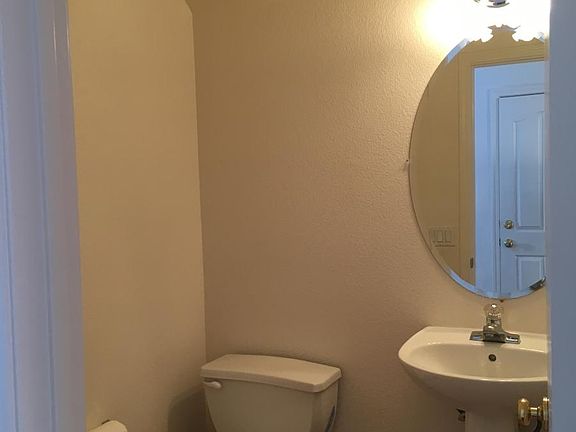 Half bathroom downstairs (facing to garage entrance)