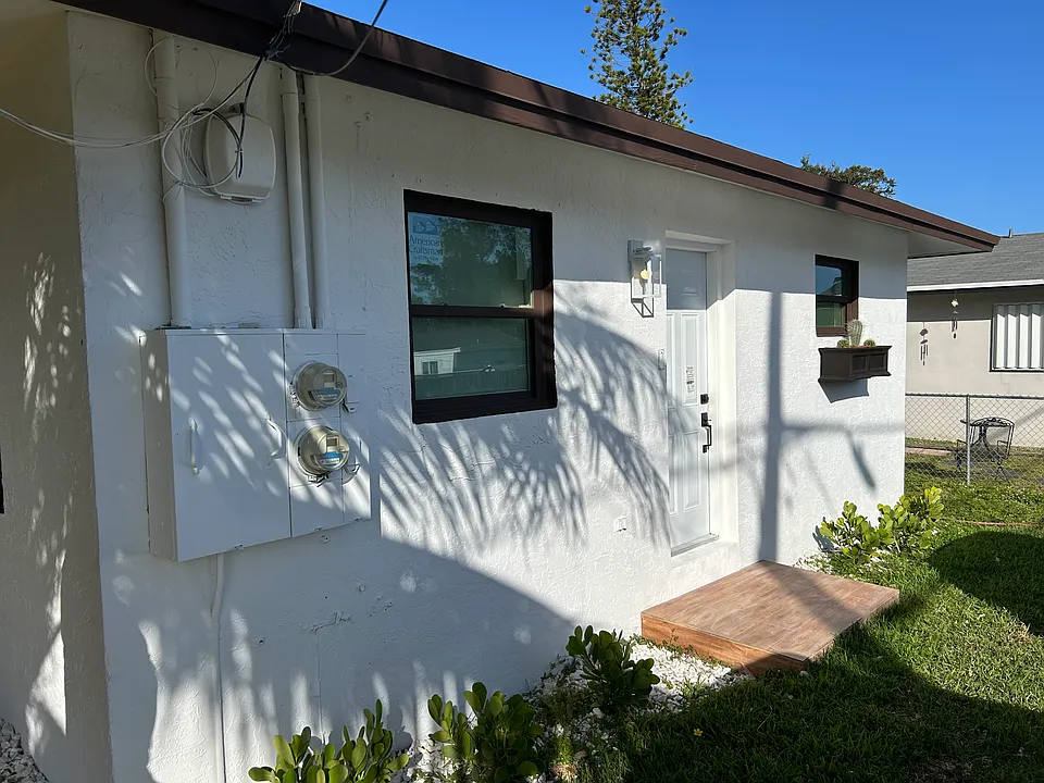 Side door that opens to the primary bedroom from the parking lot