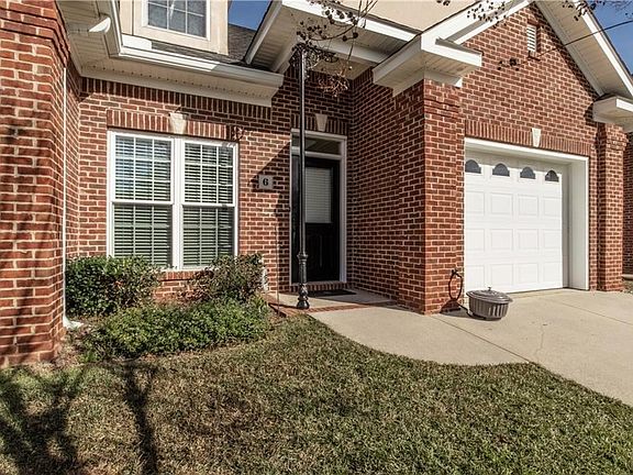 Low maintenance brick exterior, and front yard maintenance is included in the HOA fees. Wait until you see the beautiful back pa