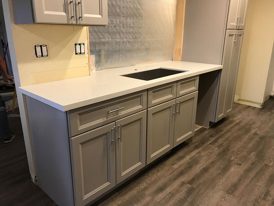 Kitchen- opens to living room. Painting to be done in grey.