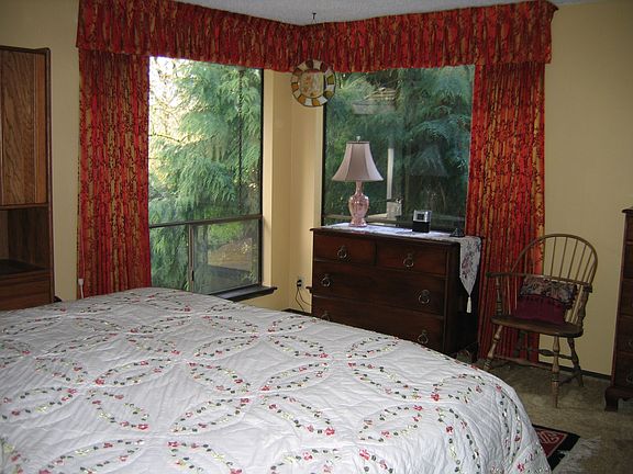 Master bedroom with views of the private oasis.