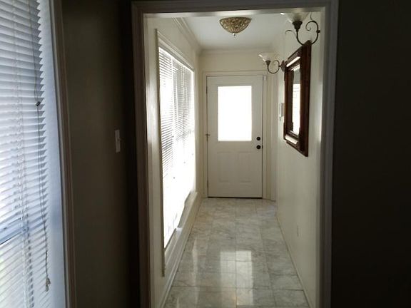 Front entrance; master bedroom entrance on the left, perpindcular to front door.