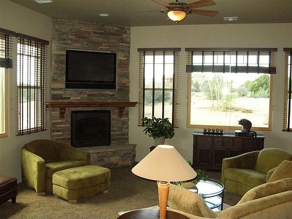 living room w/ gas fireplace and views