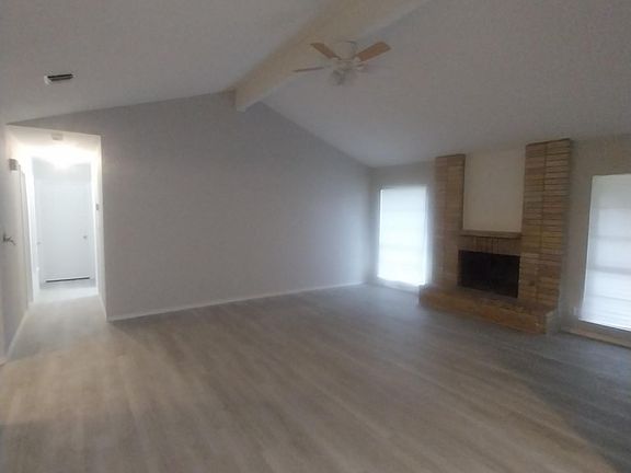 Livingroom with Ceiling Fan and Fireplace