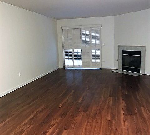 Spacious Living Area with Patio & Fireplace