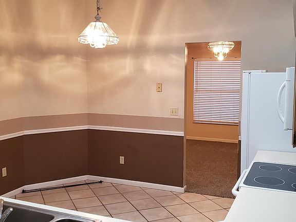 Access to kitchen via laundry room off of the garage and via dining room