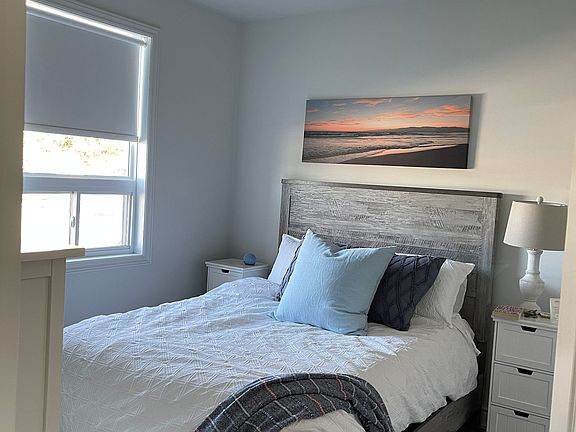 Master bedroom with walk in closet and ensuite bathroom