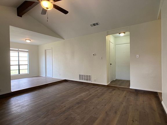 front entry, living area, dining area to left. Door on left to garage