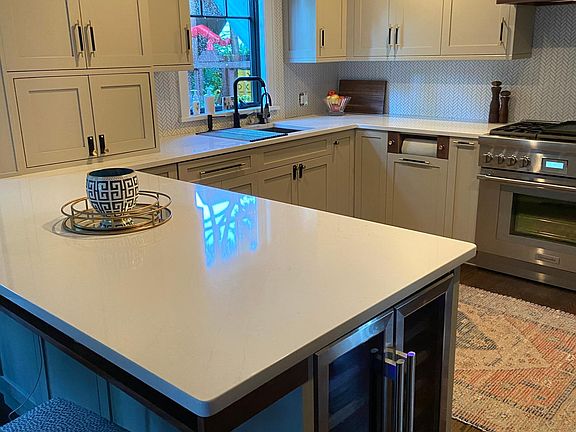 Built in wine fridge and under Island work place storage