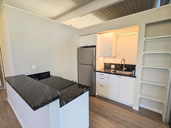 There is a cabinet directly above the sink (I just liked the angle of the photo, see the next photo)