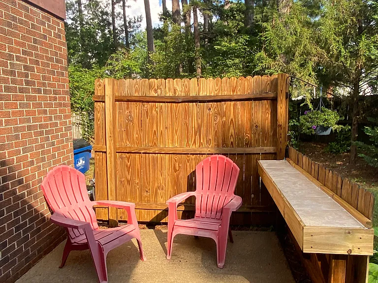 Privacy fenced patio and table area in a secluded back yard
Outdoor furniture included.
