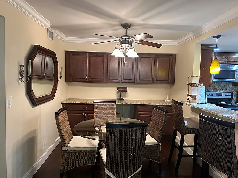 Dining room with build in desk with granite top, electric and tons of storage