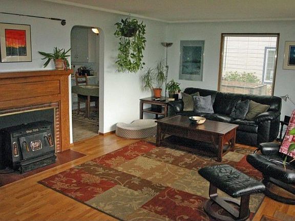 Enter the large, warm living room with refinished hardwood floors!