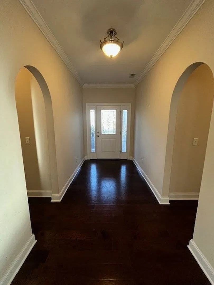 This 4-bedroom, 3-bathroom home in Porters Neck Crossing — Photo 3