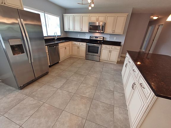 Spacious kitchen with all stainless appliances