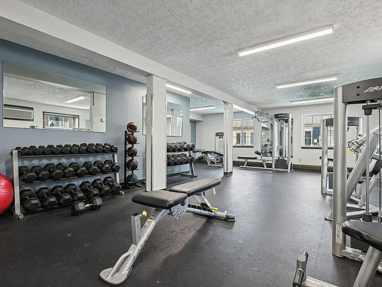 Build strength with free weights and advanced equipment at University Oaks Apartments near Kent State University.