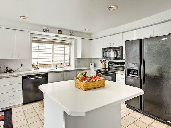 Updated kitchen with Corian counters & molded two-compartment sink; new appliances including quiet B