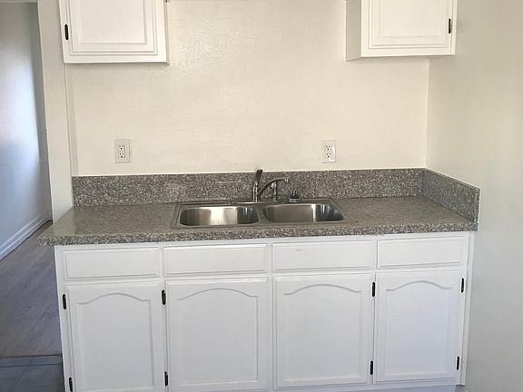 Kitchen sink, new countertop and sink.