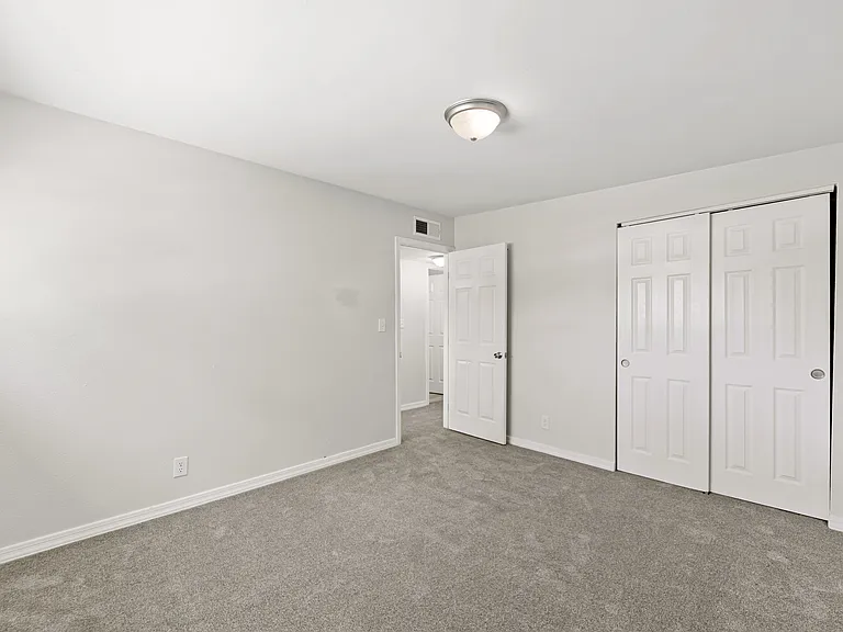 Ample closet storage rounds out this flexible fourth bedroom.