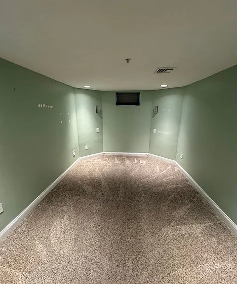 Lower floor bedroom has been updated to include bedside sconces.