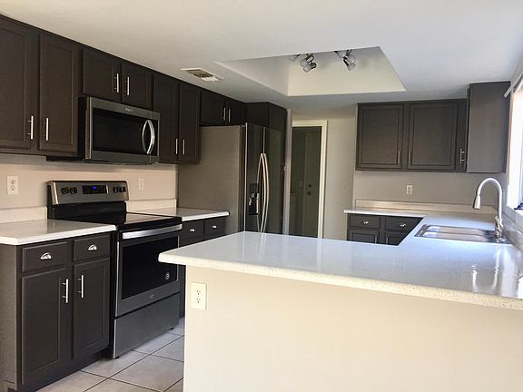 Refinished cabinets and countertops and NEWER stainless steel kitchen appliances