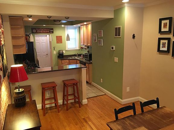 Kitchen, breakfast bar, and living space
