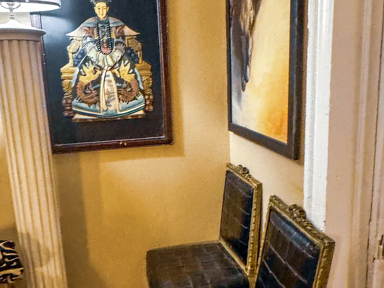 Parlor graced by framed art.