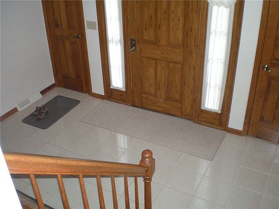 View down into foyer with ceramic tile