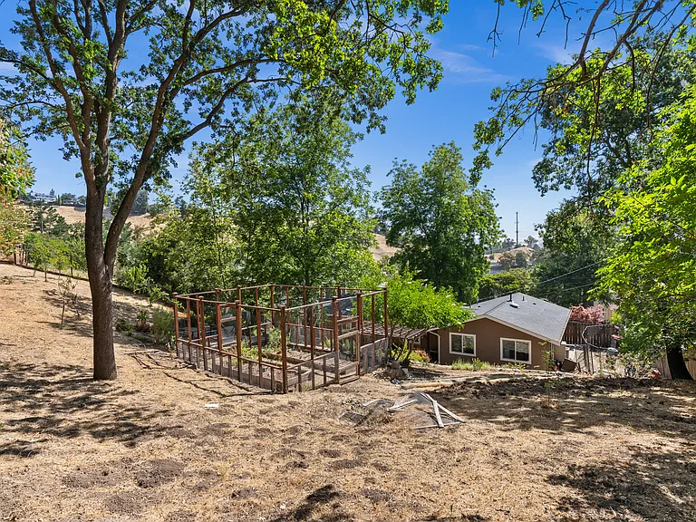 Back of house from top of yard near hammock