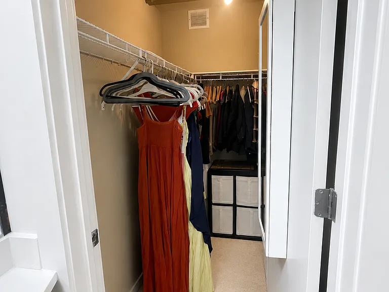 Walk-in closet off of primary bedroom