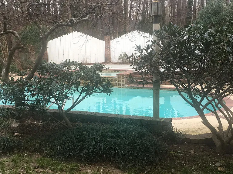 Calming waterfall off spa into pool