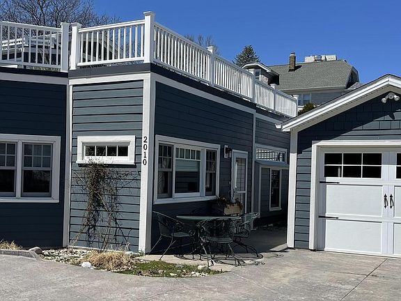 Coach-house style, self-contained apartment w/ patio, private entrance and extra-deep one-car garage.