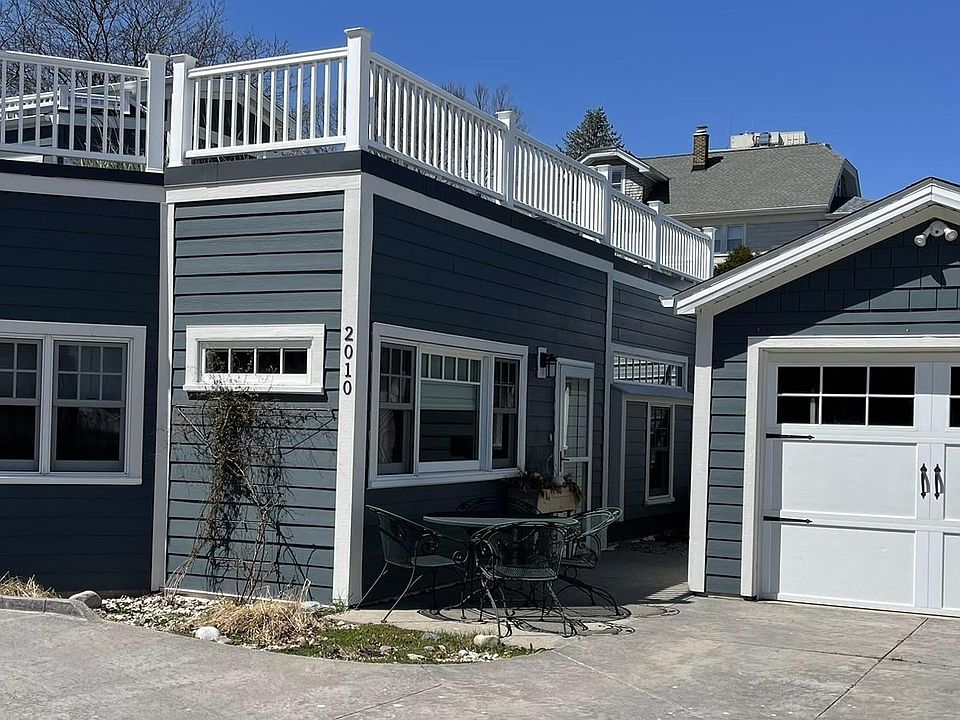 Coach-house style, self-contained apartment w/ patio, private entrance and extra-deep one-car garage.
