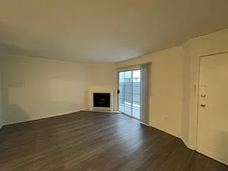 Living room with fireplace and private front patio