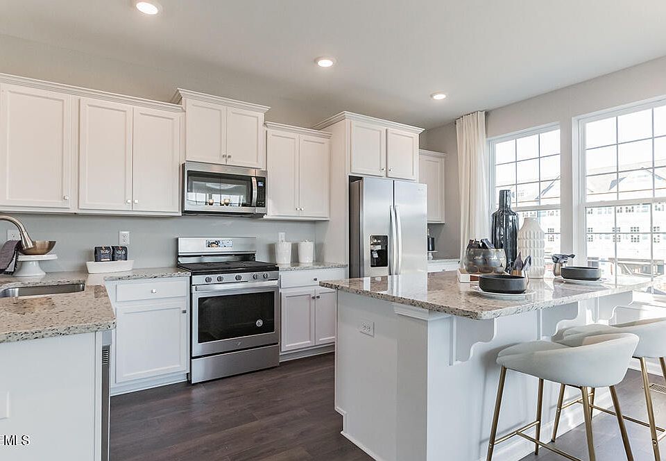 Note: Kitchen backs to wooded view and has outdoor deck