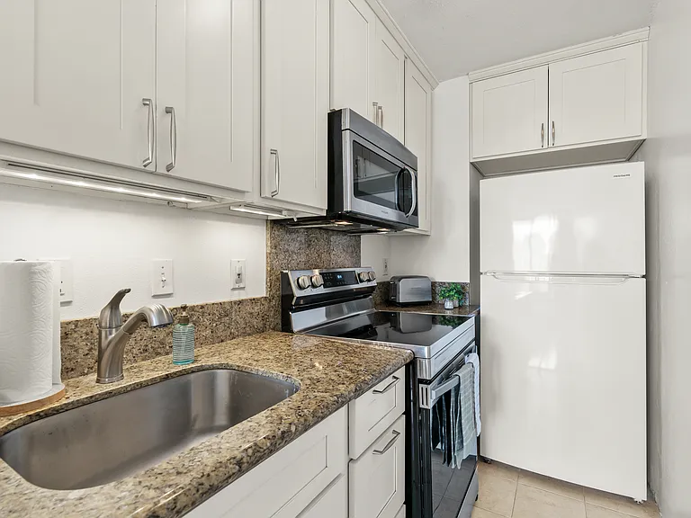 Full kitchen with a brand new oven/stove and built-in microwave
