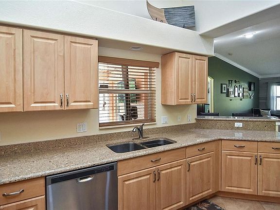 Kitchen with window view out to the pool.