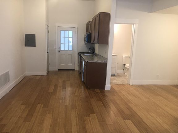 Living Room into kitchen and bathroom