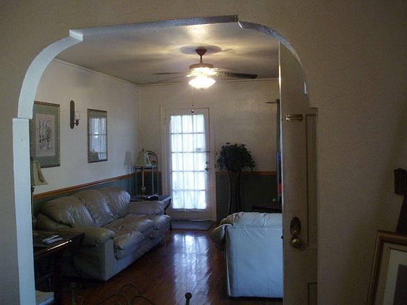 Living Room Showing Hardwood floors out to Screened Porch