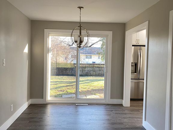 large dining area with sliding doors to backyard