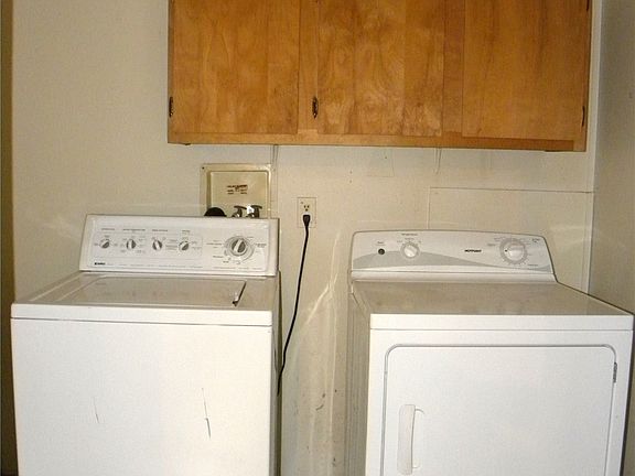 The laundry room is off of the kitchen. >