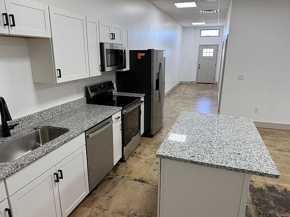 Brand new kitchen with granite counters, stainless steel appliances, new cabinets.