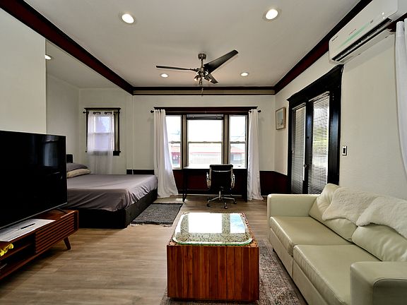 SUPERB VALUE! Fully Upgraded + Furnished LARGE Studio with many windows and private balcony