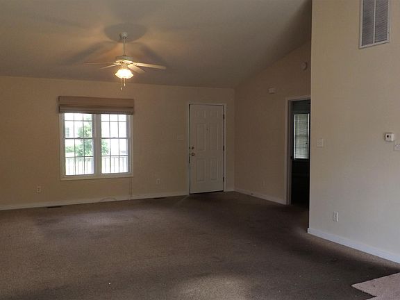 Large Great Room with vaulted ceiling & ceiling fan