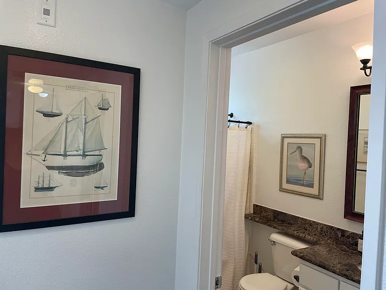 Full guest/second bathroom at the end of the hall, just past the primary bedroom.