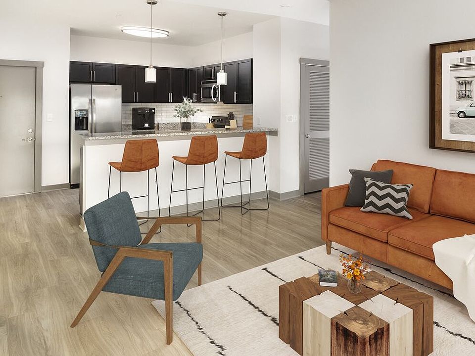 Renovated Package II Kitchen, living and dining area with hard surface flooring throughout and pendant lighting