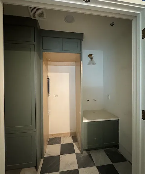 Laundry room with sink and stackable full-size washer and dryer to be installed
